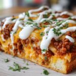 Taco Pizza with Cheesy Sour Cream Drizzle
